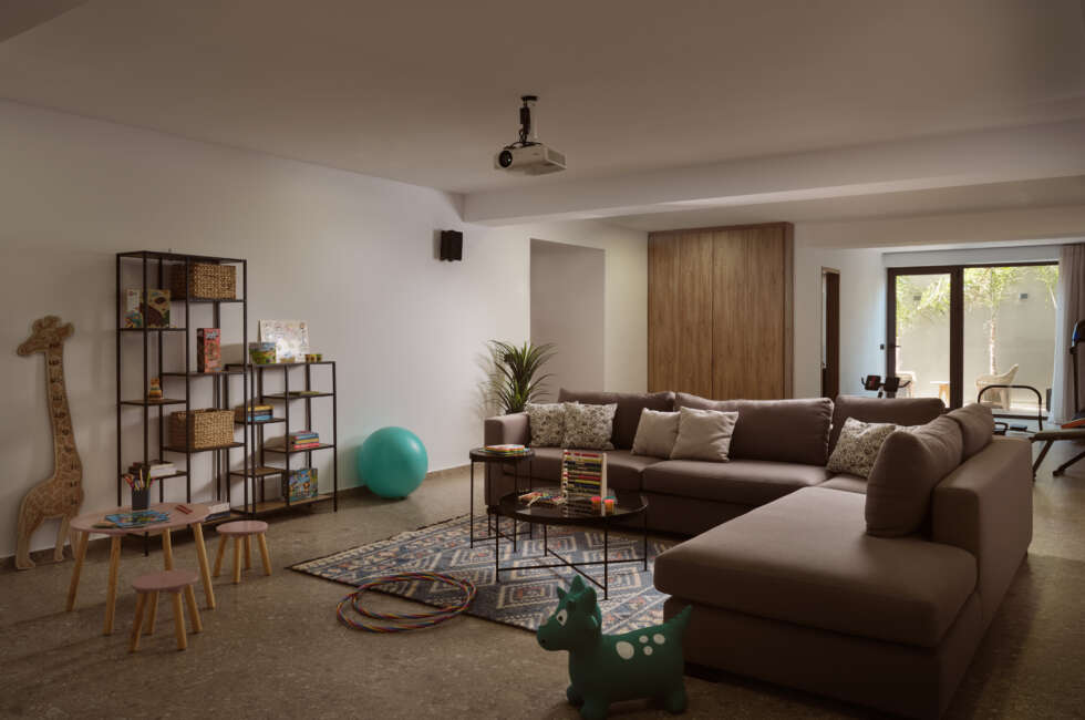 Lower Floor extra "kids play" & fitness area, featuring a spacious sofa for two more guests to sleep. Featuring also a projector for endless movie time.