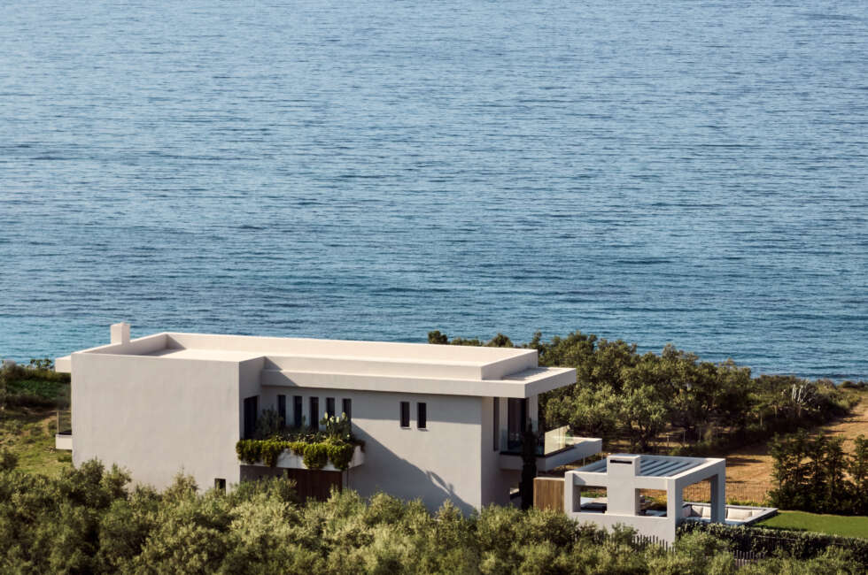 An impeccable villa reigns supremely above the Ionian Sea.